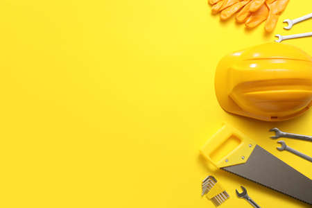 Set of construction tools on color background