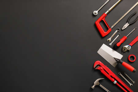 Set of construction tools on dark background