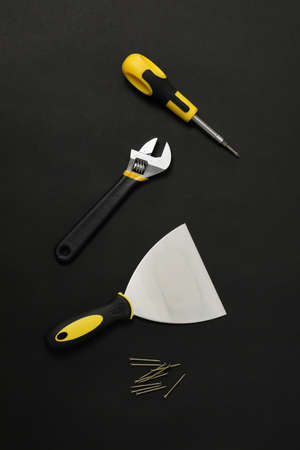 Set of construction tools on dark background