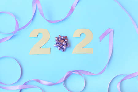 Figure 2021 with Christmas decor on color background