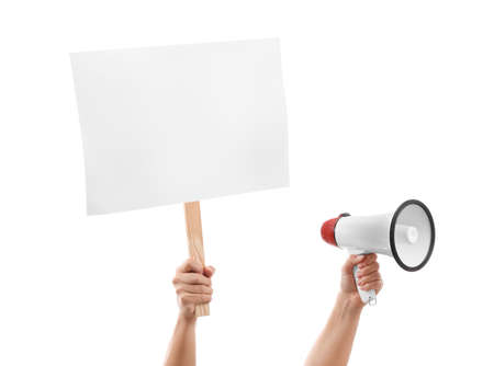 Hands of protesting woman with megaphone and placard on white backgroundの写真素材