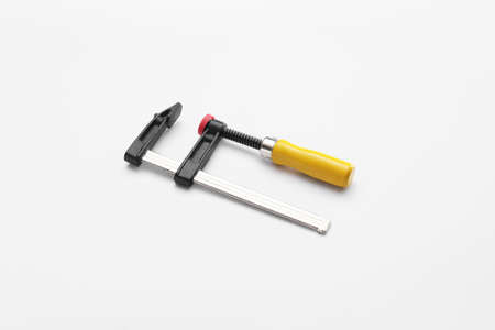 Carpenter's clamp on white background