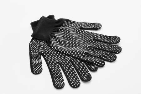 Fabric gloves on white backgroundの写真素材