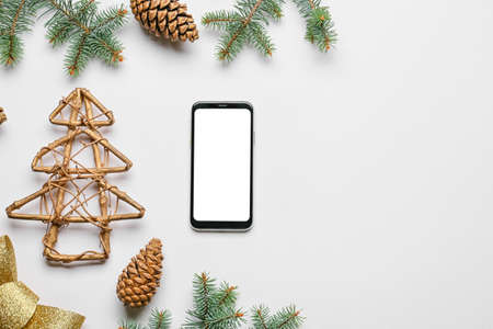 New Year composition with mobile phone on light backgroundの写真素材