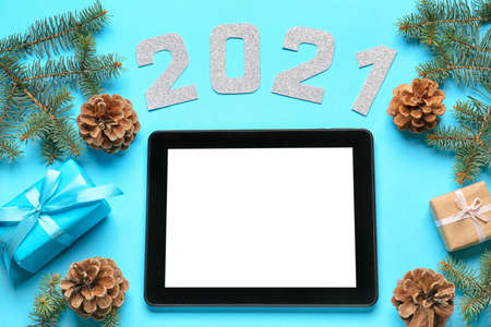 New Year composition with tablet computer on color backgroundの写真素材