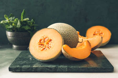 Sweet ripe melons on tableの写真素材