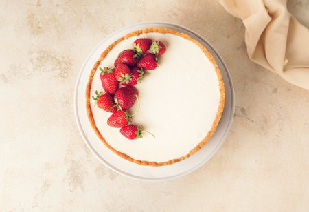 Tasty cheesecake with strawberry on gray backgroundの写真素材