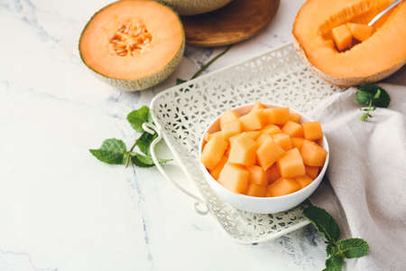 Composition with sweet ripe melon on tableの写真素材