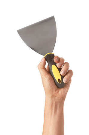 Spatula in male hand on white background