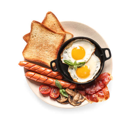 Traditional English breakfast with fried eggs in plate on white backgroundの写真素材