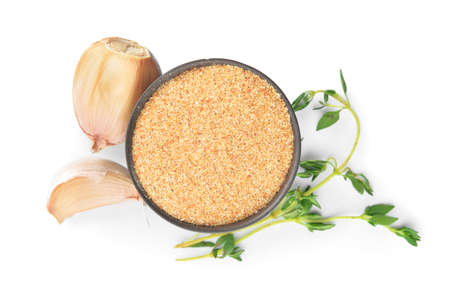 Bowl with aromatic powdered garlic on white backgroundの写真素材