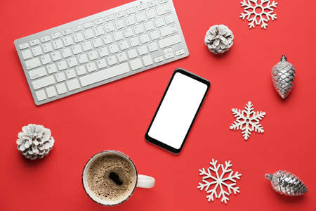 New year composition with modern devices and cup of coffee on color backgroundの写真素材