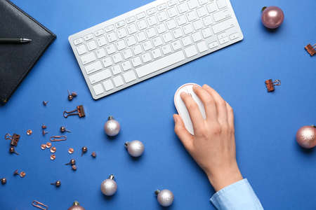 New year composition with computer keyboard and mouse on color background