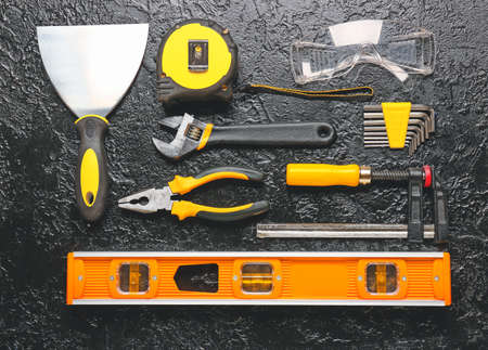 Set of construction tools on dark backgroundの写真素材
