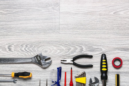 Set of construction tools on light wooden backgroundの写真素材