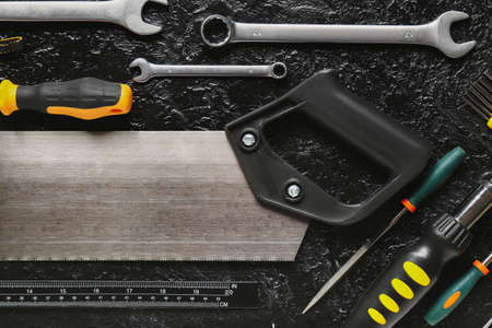 Set of construction tools on dark background