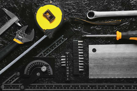 Set of construction tools on dark backgroundの写真素材