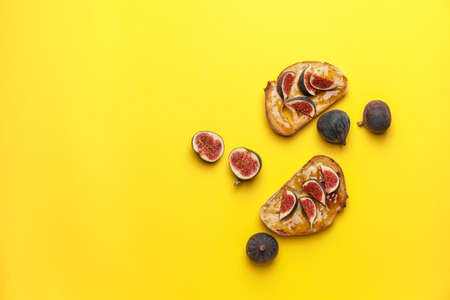 Tasty sandwiches with sweet fig jam on color backgroundの写真素材
