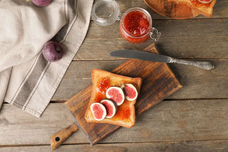 Tasty sandwich with sweet fig jam on tableの写真素材