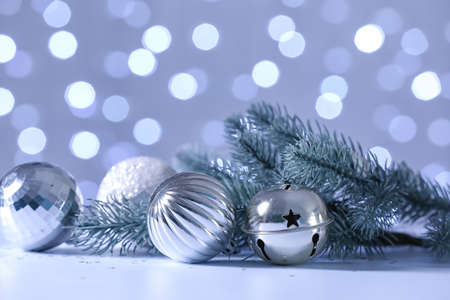 Christmas decor on table against defocused lightsの写真素材