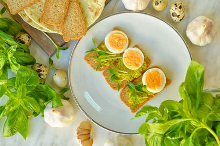 Plate with tasty sandwiches on table
