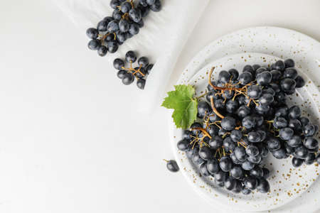 Composition with sweet ripe grapes on tableの写真素材
