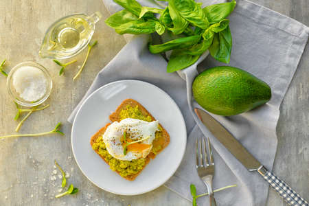 Plate with tasty sandwich on table