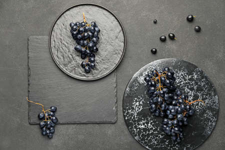 Composition with sweet ripe grapes on table