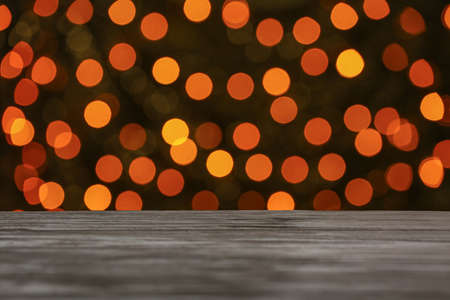 View of table against blurred Christmas lights