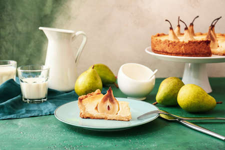 Plate with tasty pear cake on tableの写真素材