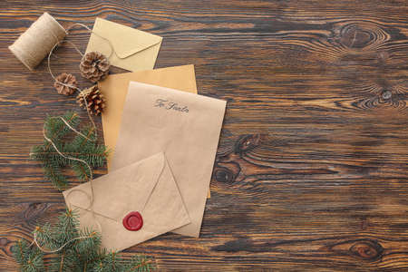 Letter to Santa and Christmas decor on table