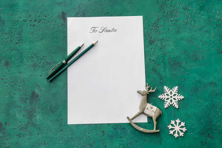 Letter to Santa and Christmas decor on color background