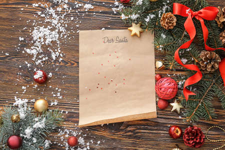 Letter to Santa and Christmas decor on wooden backgroundの写真素材