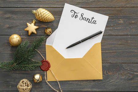 Letter to Santa and Christmas decor on table