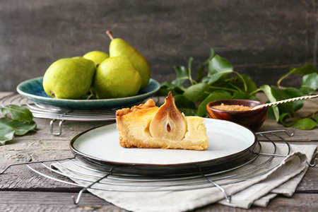 Plate with tasty pear cake on tableの写真素材