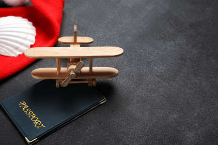 Passport and airplane on dark backgroundの写真素材