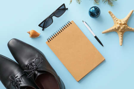 Composition with Christmas decor, notebook and male accessories on color background