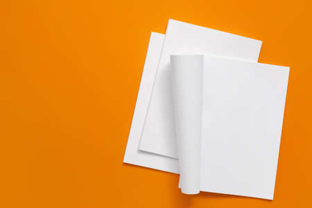 Blank magazines on color background
