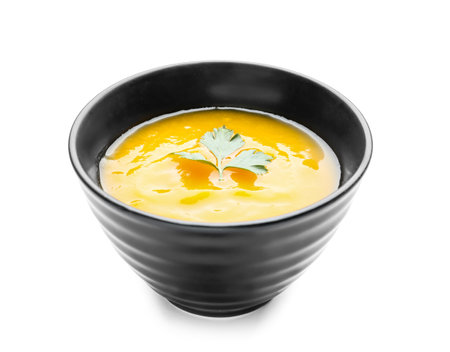 Tasty pumpkin cream soup in bowl on white backgroundの写真素材