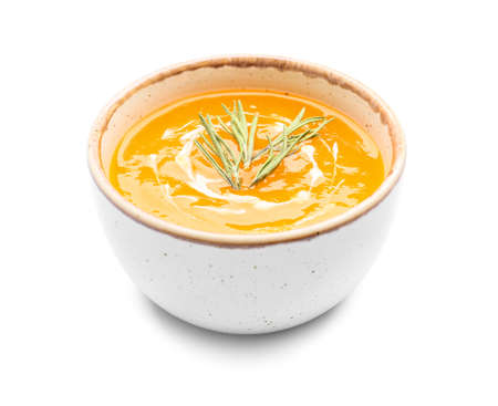 Tasty pumpkin cream soup in bowl on white backgroundの写真素材
