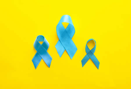 Blue ribbons on color background. Prostate cancer awareness conceptの写真素材
