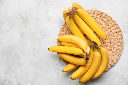 Tasty bananas on light backgroundの写真素材