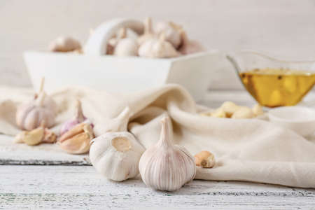 Fresh garlic on light wooden backgroundの写真素材