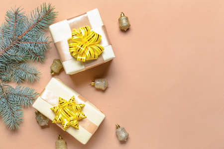 Beautiful Christmas decor and gift boxes on color backgroundの写真素材