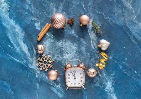 Beautiful Christmas composition with alarm clock on color backgroundの写真素材