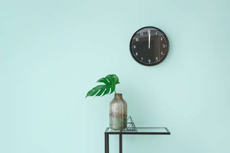 Interior of modern room with table and clock