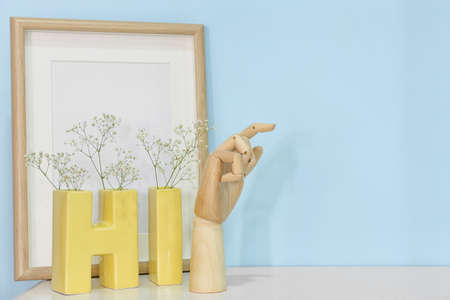 Wooden hand with decor on color backgroundの写真素材