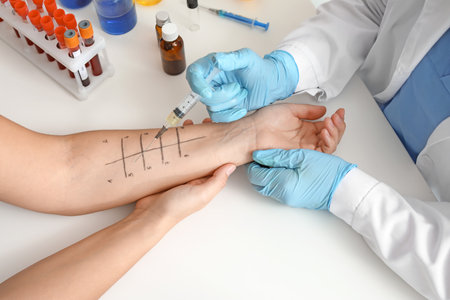 Young woman undergoing procedure of allergen skin tests in clinic