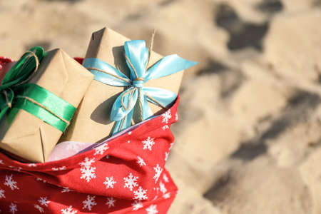 Santa Claus bag with gifts on beach, closeupの写真素材