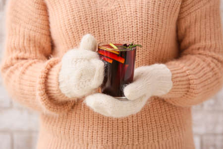 Woman with tasty mulled wine in cup, closeupの写真素材